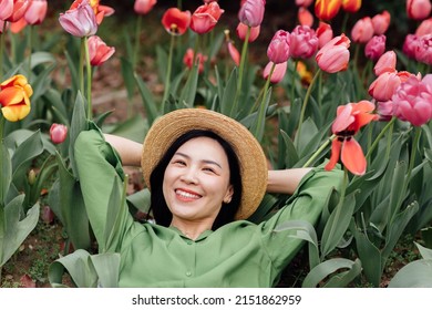 Candid Lifestyle Portrait Of Happy Young Beautiful Asian Sexy Woman Enjoying Life Outdoor In Park At Spring. Smiling Millennial Girl With Perfect Clear Glow Skin And Long Brunette Hair