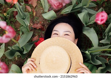 Candid Lifestyle Portrait Of Happy Young Beautiful Asian Sexy Woman Enjoying Life Outdoor In Park At Spring. Smiling Millennial Girl With Perfect Clear Glow Skin And Long Brunette Hair