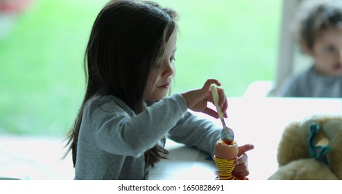 
Candid Little Child Girl Eating Egg Oeuf A La Coque