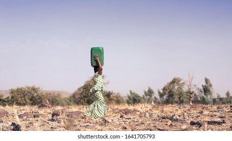 Candid photo of African Girl Saving fresh Water in an arid zone
