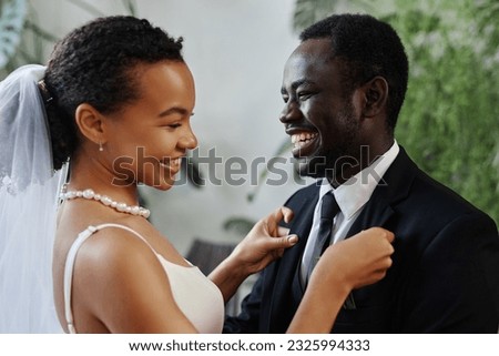 Candid portrait of happy bride and groom meeting before wedding ceremony 