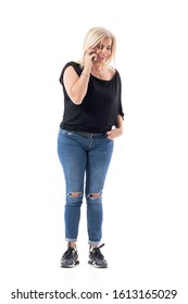 Candid Portrait Of Happy Middle Age Woman Talking On The Cellphone Smiling With Closed Eyes. Full Body Length Isolated On White Background. 