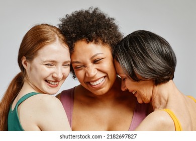 Candid portrait of three diverse young women laughing happily together - Shutterstock ID 2182697827