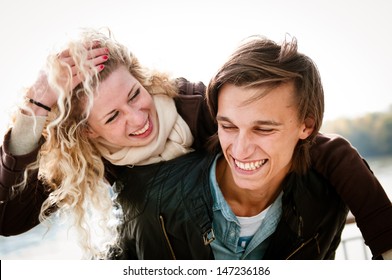 Candid Portrait Of Young Couple Enjoying Life Together Outdoor