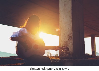 Candid Silhouette Woman Chill Play Acoustic Guitar Musician 
Artists Female Sad Mood Activity Music 
At Balcony Flare Lighting Sunset Background