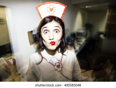 Candid Snapshot Of A Young Adult Woman Disguised As A Nurse Goofing Off In Front Of The Camera.