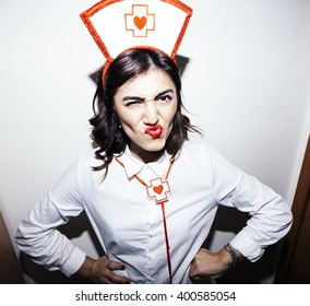 Candid Snapshot Of A Young Adult Woman Disguised As A Nurse Goofing Off In Front Of The Camera.