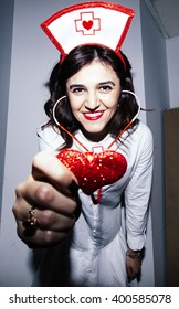 Candid Snapshot Of A Young Adult Woman Disguised As A Nurse Goofing Off In Front Of The Camera.