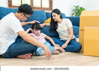 Candid Of Young Parents Teach, Care And Coach Little Daughter With Positive Behavior In Child Anger Management Parenting Concept. Deal Emotional Kid With Love Relationship And Connect At Home.