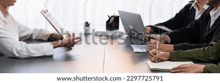 Candidate and interviewers discuss work experience and qualifications in friendly job interview at corporate office. HR team evaluates job application while interviewee explaining profile. Prodigy
