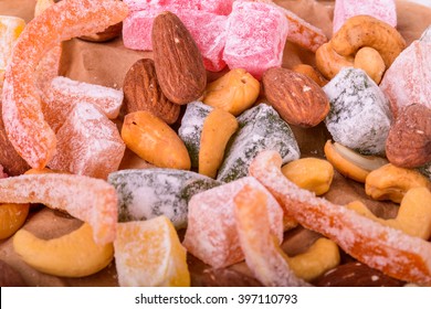 Candied fruits on a wooden background