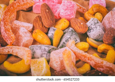 Candied fruits on a wooden background