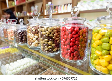Candies in glass jars in candy shop