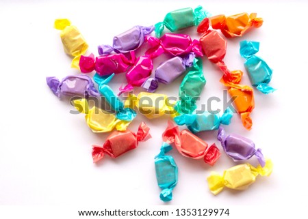 Candies isolated on white background. Sweet candy , toffee , candies isolated white background. Caramel toffee candy in colorful package on white background.