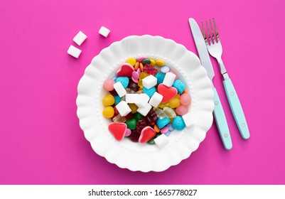 Candies And Sugar On A Plate. Too Much Sugar And Unhealthy Food Concept.