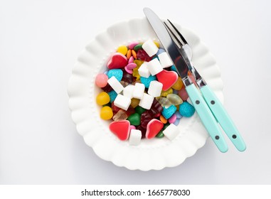 Candies And Sugar On A Plate. Too Much Sugar And Unhealthy Food Concept.