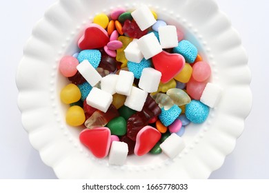 Candies And Sugar On A Plate. Too Much Sugar And Unhealthy Food Concept.