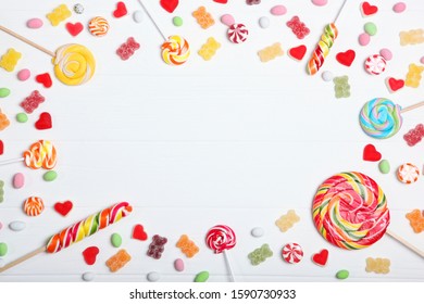 Candies and sweets on a light background, top view with place for text.
 - Powered by Shutterstock