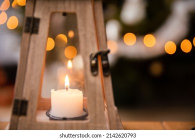 A Candle Burns Closed Inside A Decorative Lantern On Christmas Day.