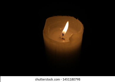 Candle burns in the dark