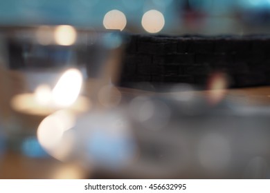 Candle In Clear Glass On The Table, Ready For Dinner For Sweet Couple In Romantic Home With Bokeh Background