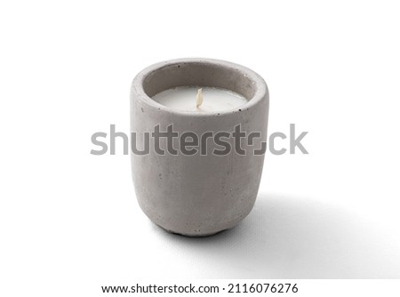 candle in a concrete candlestick on a white background. insulation.