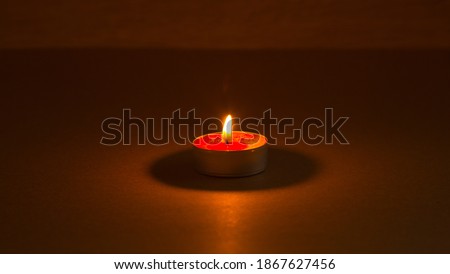 candle and fire - a symbol of memory and continuation of life. Memorial Day in the day of sorrow in memory of the victims of the Holocaust and genocide.