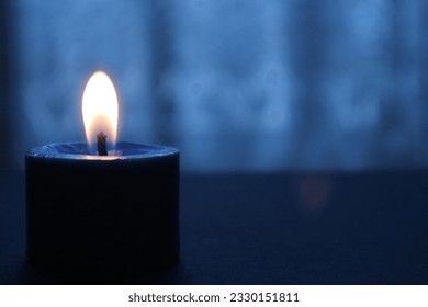 A Candle Flame In The Dark