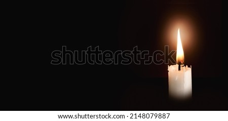 candle flame isolate on black background, symbol of prayer and remembrance