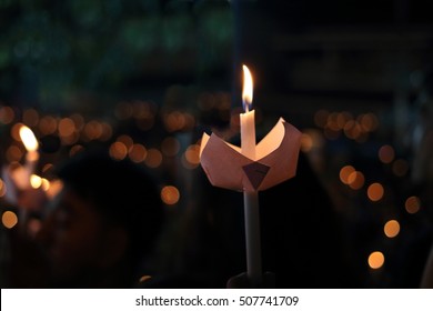 Candle Flame Light At Night With Bokeh Background.