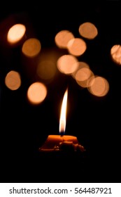 Candle Flame Light At Night With Bokeh On Dark Background