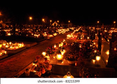 Candle flames illuminating a Polish cemetery during All Saint's Day
