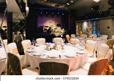Candle and flower decoration for an event party or wedding on the table in restaurant - Powered by Shutterstock
