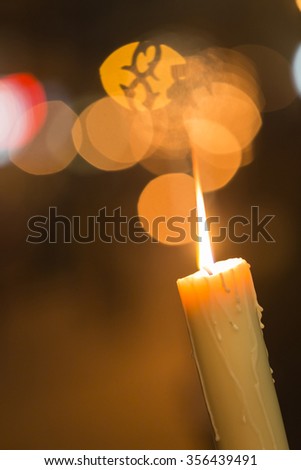 Candle light with light bokeh in the background