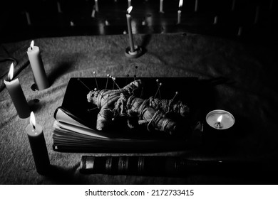 Candle light in the dark and curse doll, candle light ceremony - Shutterstock ID 2172733415