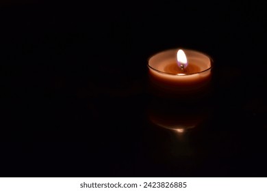 Candle light in dark room - Powered by Shutterstock