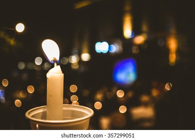 A Candle Light During A Christmas Recital At Rio De Janeiro.