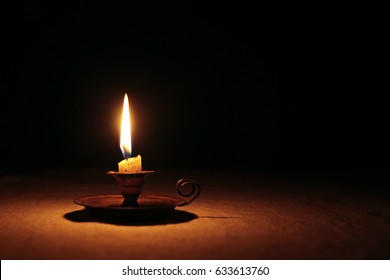 Candle Light Into Dark Background