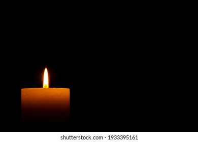 Candle Light On The Black Background