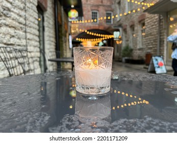 Candle Light On Street Table Top In Rainy City In Medieval Tallinn Old Town 