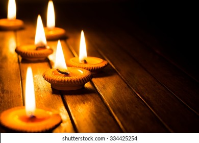 Candle Light On Wood Plate