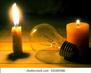 candle light shine on incandescent bulb, no electricity  makes electrical equipment useless