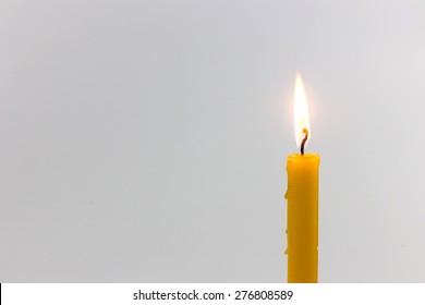 Candle Light  For Spirituality Ceremony Against Grey Background