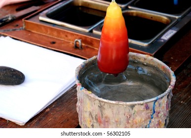 Candle Making - Dipping In A Metal Bucket Of Water