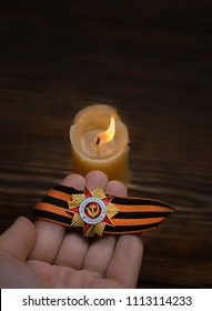 candle to memory of war. St.George ribbon, military order  and candle - symbol of memory of second world war, veteran, war of 1941-1945. Day of Remembrance and Mourning, 22 june