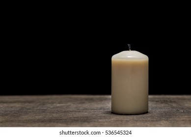 Candle With No Flame On Wood And Black Background