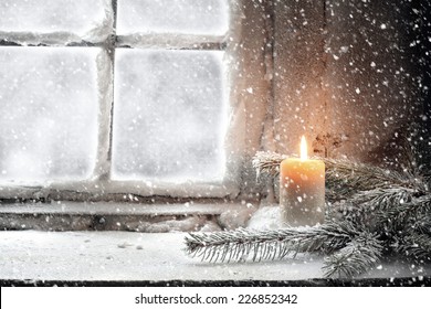 candle and snow 