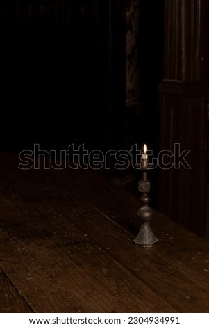 A candle that burns in the hall of the 18th century on the table, the palace, which during the Soviet Union was shamelessly converted into a hospital for patients with tuberculosis