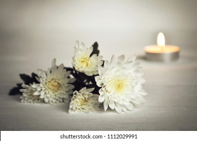 Candle and white flowers