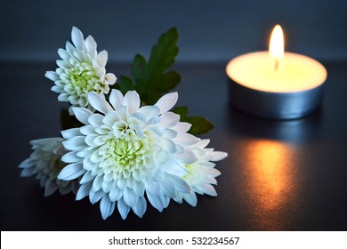 Candle and white flowers